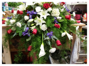 Red, white and blue casket spray